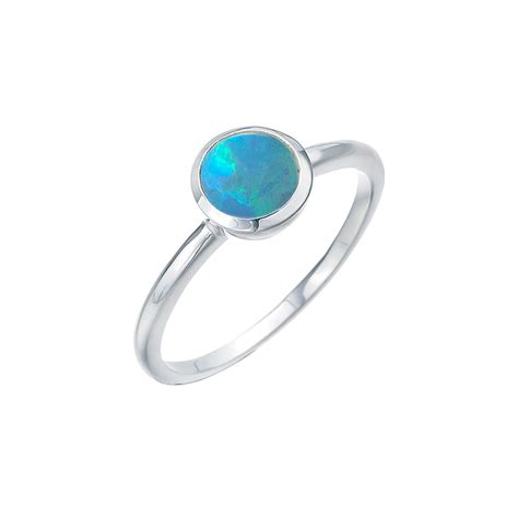 ROUND CZELLINE OPAL RING .